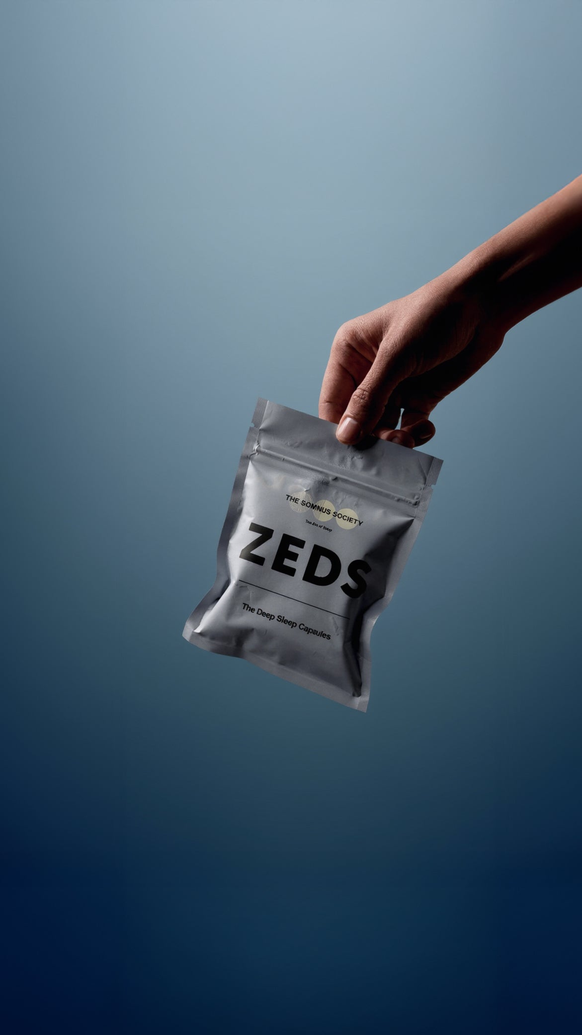ZEDS Deep Sleep Capsules pouch held against sky